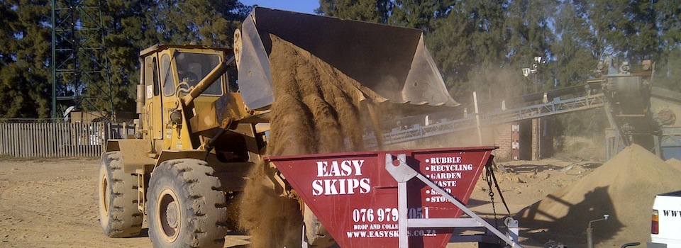 Tipping stones in a EasySkips bin with trailer