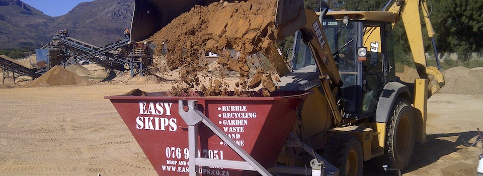 Loading an EasySkips bin with sand